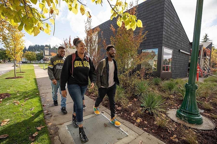 Students walking in front of the Lyllye Reynolds-Parker Black Cultural Center