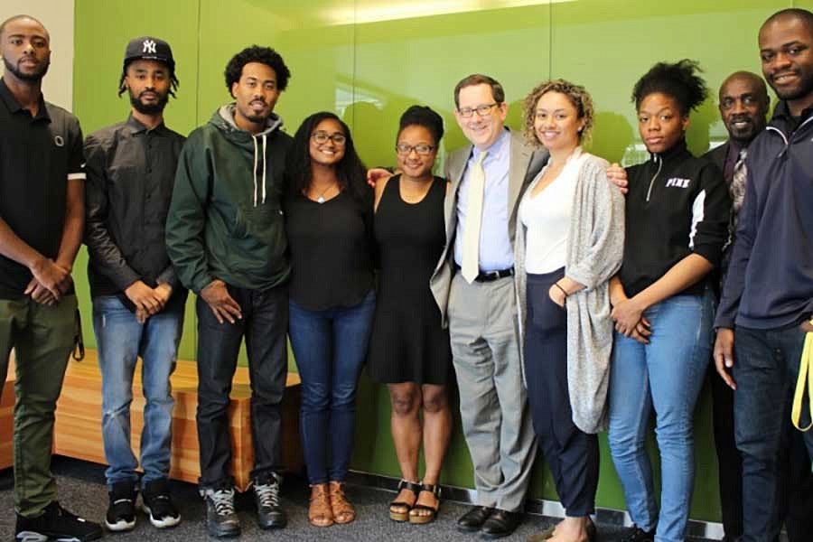 President Michael Schill and Vice President for Student Life Kevin Marbury with members of the Black Student Task Force.