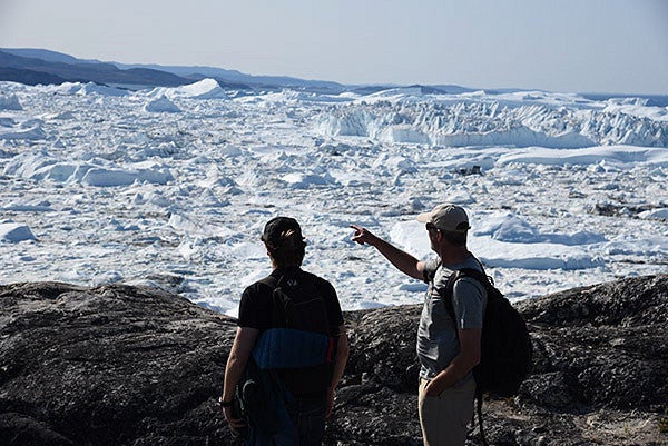 Casey Shoop and Mark Carey inspect a glacier