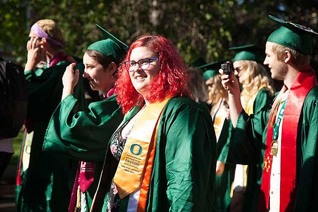 Students make their way down 13th avenue for the Commencement ceremony