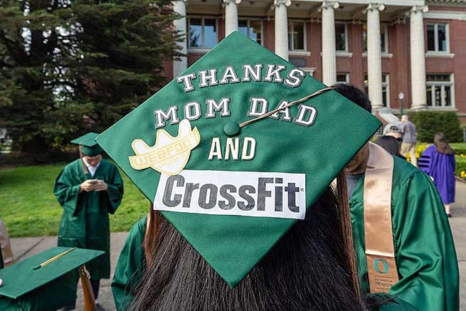 Graduation cap reads: Thanks mom and dad and CrossFit.