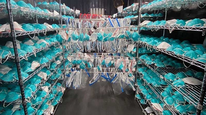 Rows of N95 masks hanging on racks