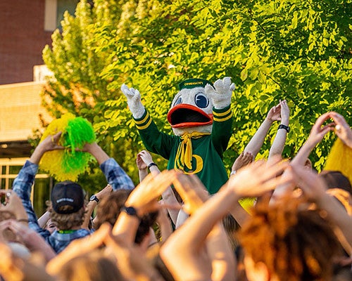 The Duck with students "Throwing the 'O'"