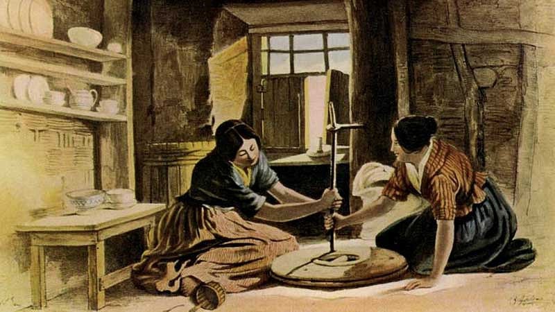 Illustration of two women grinding grain