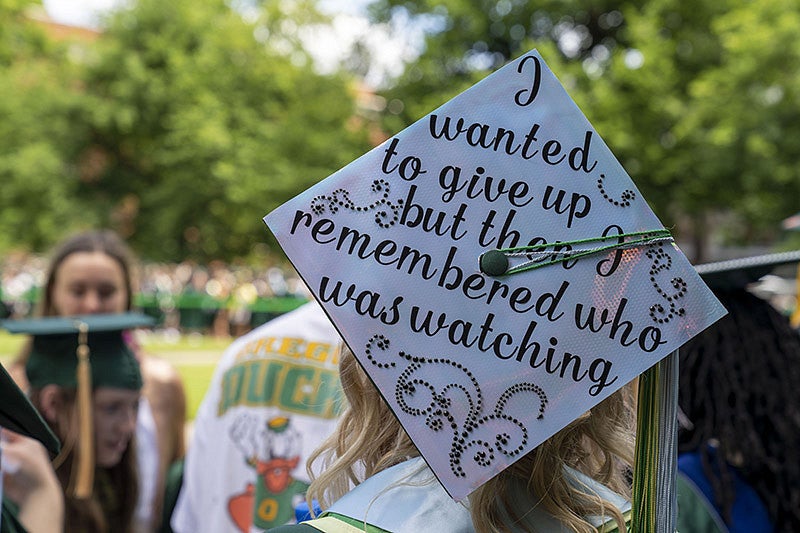 A graduation cap reading "I wanted to give up but then I remembered who was watching'