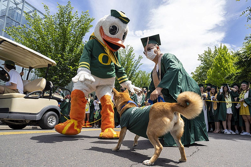 The Duck with a dog at the 2021 UO Grad Parade