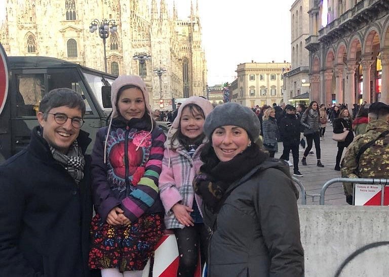 Alfredo Burlando, Melissa Graboyes and family in front of Milan’s duomo cathedral during happier times January 6, 2020.
