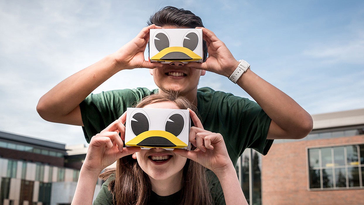 Hannah Lewman and Travis Kim with the Duck VR goggles