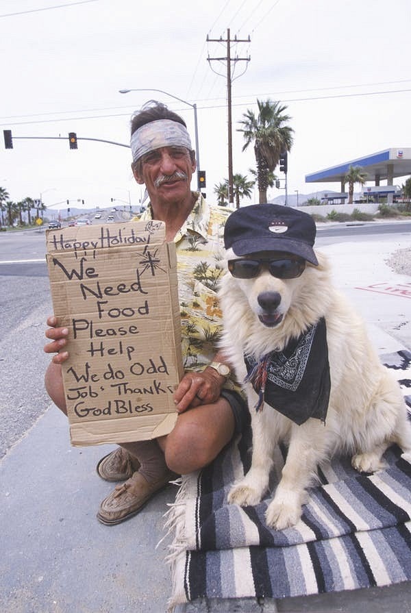 Man with sign asking for food