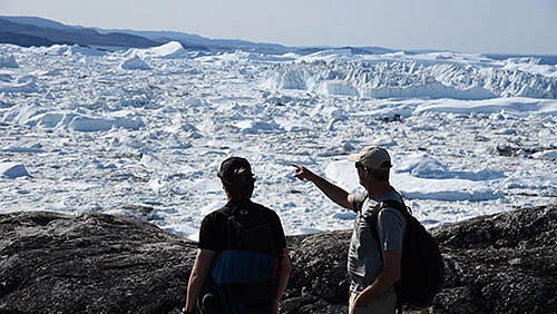 Mark Carey looking out over a glacier