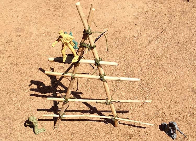 A model of a potential anti-poaching tower made of twigs and army men toys