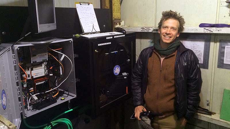 Paul Cziko in front of McMurdo Oceanographic Observatory electronics