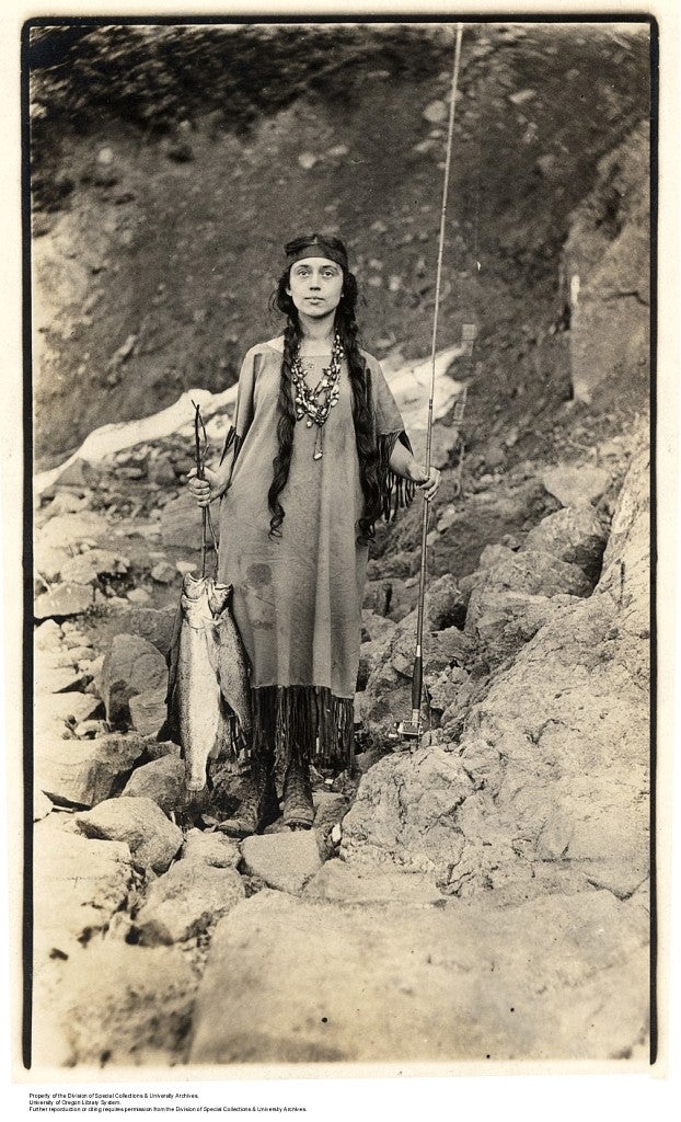 Opal shows off her catch after a successful fishing expedition. Photograph courtesy University of Oregon Libraries, Special Collections and University Archives