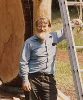 Theodore Palmer stands next to the new Douglas fir tree round exhibit in this 1986 photo. Photograph courtesy Theodore Palmer