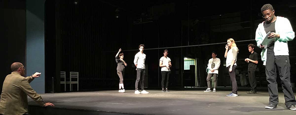 Students rehearsing on stage