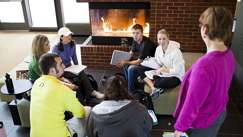 Students studying in an Education building's common area