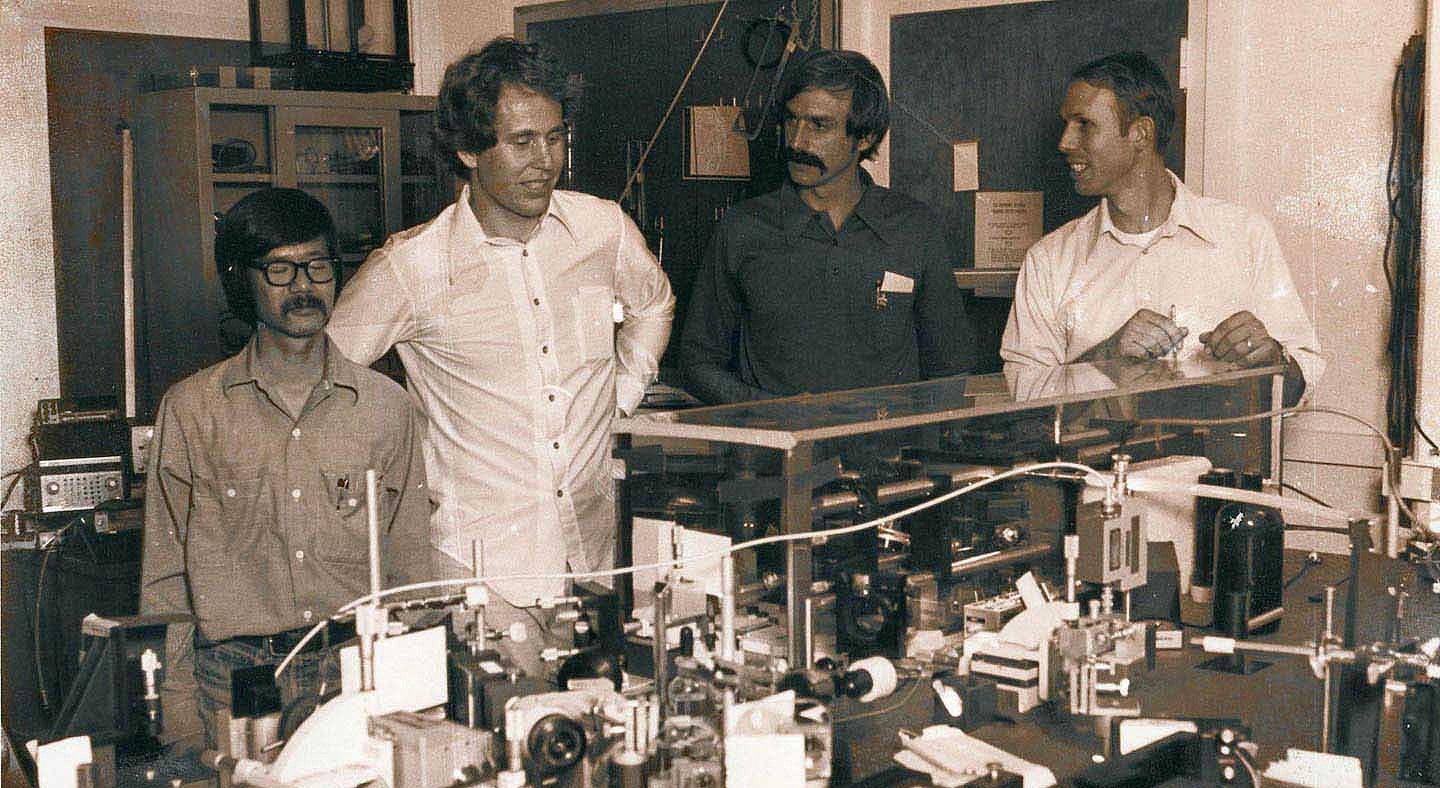 David Wineland in a lab with other scientists