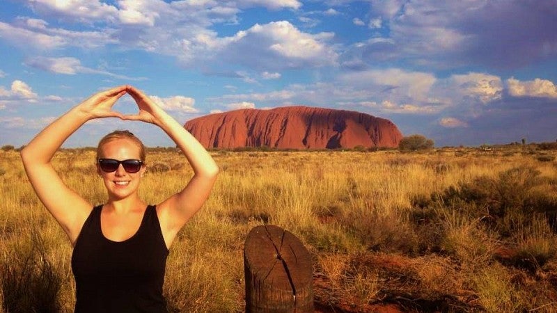 Sarah Rosencras, Class of 2013, throwing the O at Uluru, Australia