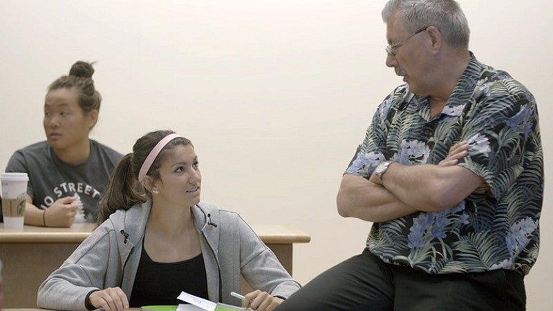 Jenna Prandini in the classroom with her management professor, Neil Chinn