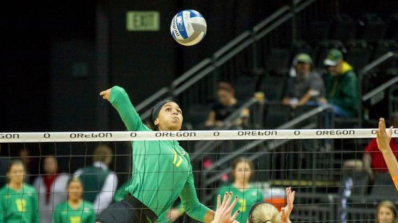 Ronika Stone making a shot over the net