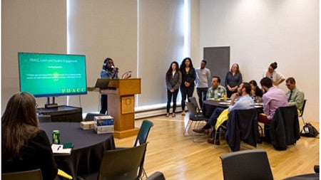 Members of the UO President’s Diversity Advisory Community Council meet with students
