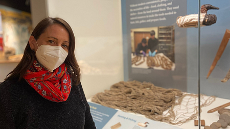Doctoral student and anthropological collections manager Elizabeth Kallenbach of the Museum of Natural and Cultural History with an exhibit showing examples of early weaving using material from plants.