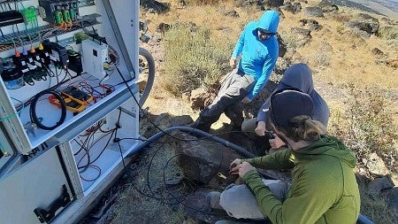Members of the Oregon Hazards Lab deploy sensors in the field