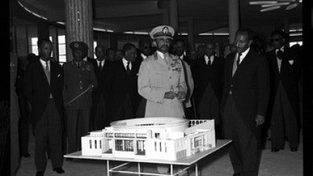 Haile Selassie, Ethiopia's longtime emperor and commissioner of Africa Hall, in front of a model for the hall in 1961. Photo courtesy of United Nations