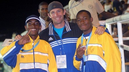 Andy Biehl (center), a masters student at the Warsaw Sports Marketing Center, with medal-winning pole vaulters in Saint Lucia in 2009. Photograph courtesy Andy Biehl