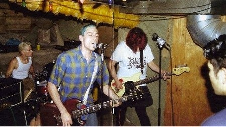 Oswald Five-O plays a basement party (drummer, Robert Christie '97; guitar and vocals, Tucker; bass, Rios) Photograph courtesy Gayle Forman 