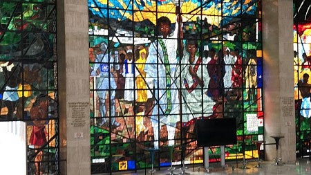 A floor-to-ceiling stained glass windows depicts Africa's past, present, and future. Photo courtesy David Koch