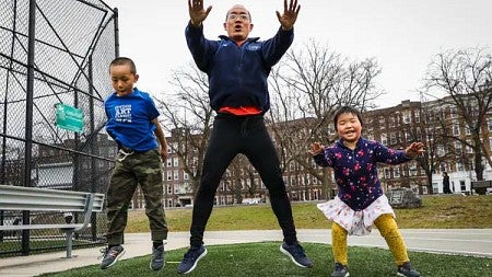 Father and children exercising