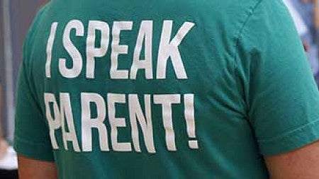 The back of a shirt that says I speak parent