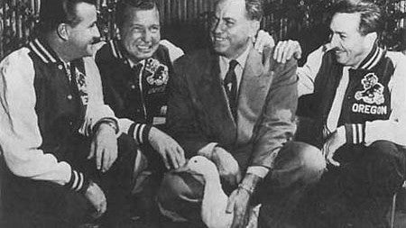Walt Disney (right) and UO athletic director Leo Harris (with duck) had a handshake agreement to allow the use of a UO mascot based on Disney's Donald. Photograph courtesy UO Libraries Special Collections and University Archives
