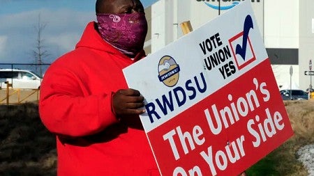 Union worker carrying sign