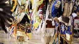 Dancers in Native American regalia