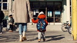 Parent walking child to school