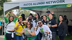 Members of the Patos Alumni Network at a football game