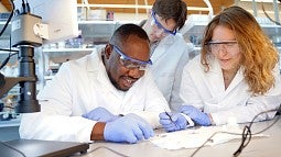 Felix Deku (left) in his Knight Campus lab
