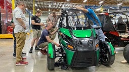 A new Arcimoto vehicle getting final inspections