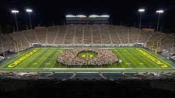 Class of 2025 forming the O at Autzen