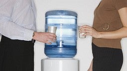 Man and woman at water cooler