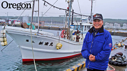 Tatsuo Tachibana with his fishing boat, the Shinryu Maru No. 3, in which he rode out the tsunami that struck Japan on March 11, 2011. Photograph by Bonnie Henderson