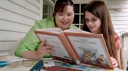 A child reading with a teacher