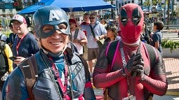 Fans in Captain America and Deadpool costumes