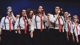 Members of the all-female a cappella group Divisi
