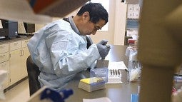 Lab worker running tests