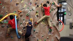Kids on climbing wall