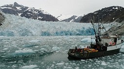 Research boat near glacier