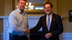 UO President Michael Schill and UAUO President Michael Dreiling sign new three-year contract